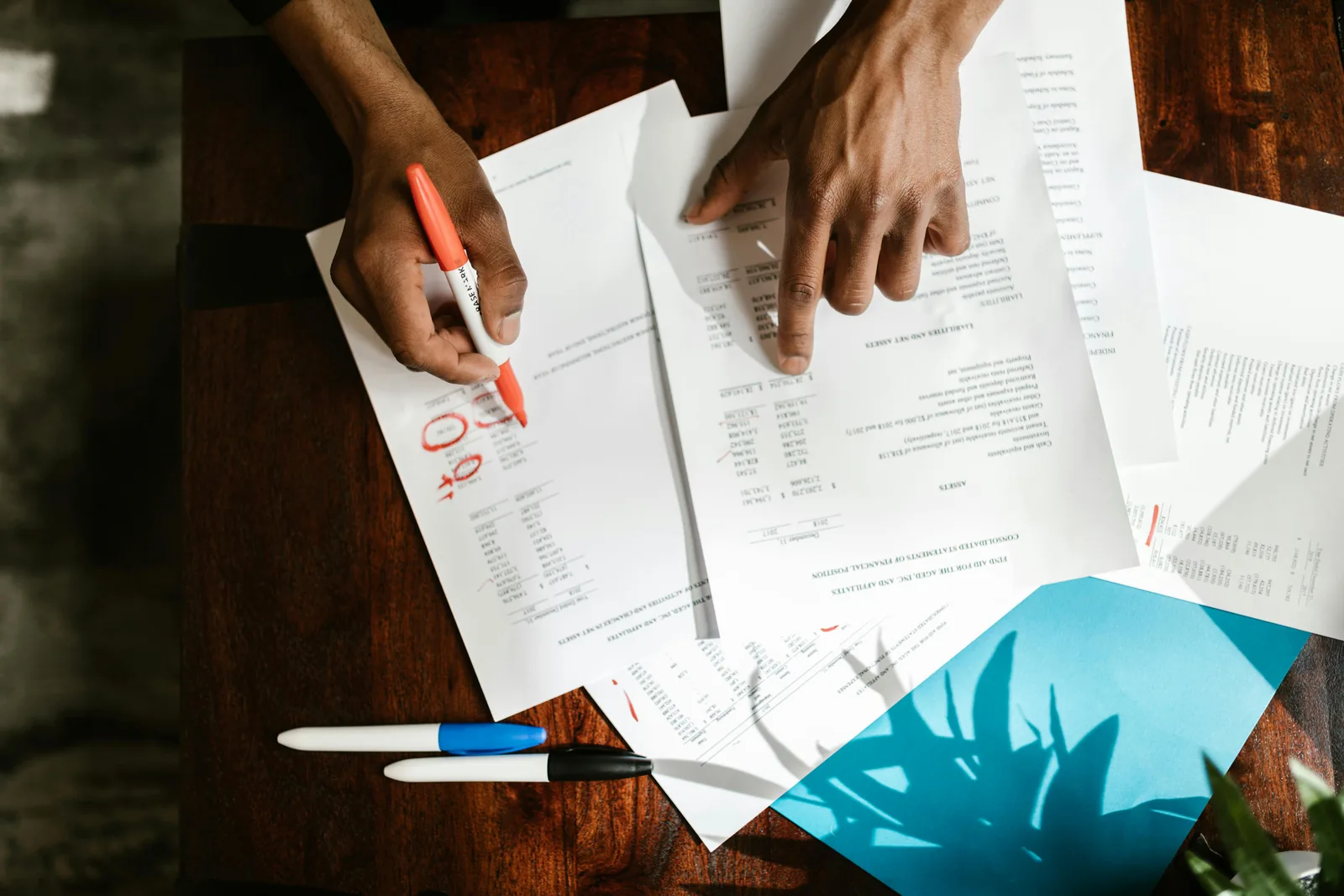 Finance team manually reconciling transactions in spreadsheets.